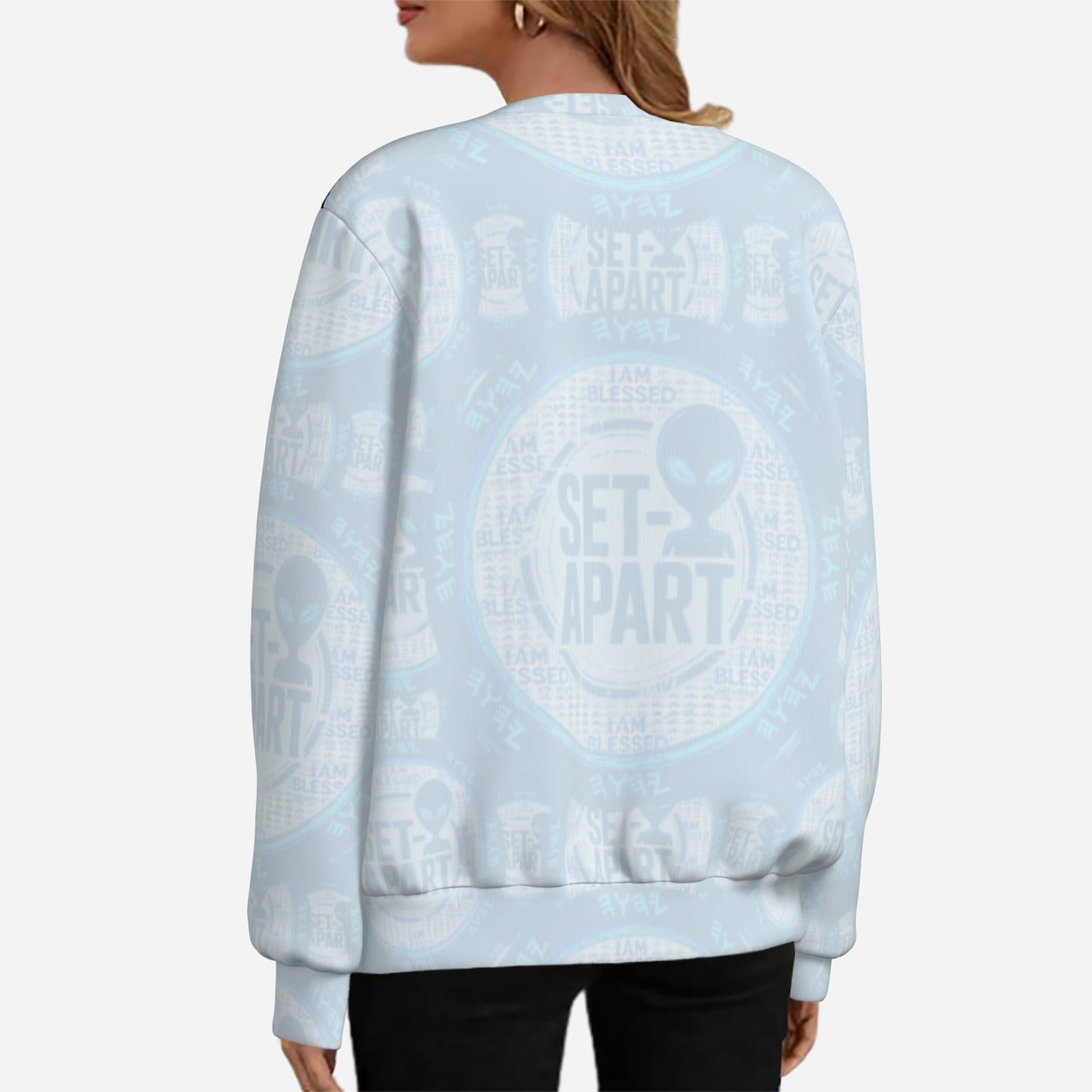 Back of a light blue sweatshirt with a faded "SET-APART" alien graphic pattern.