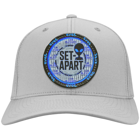 Silver cap with a circular patch featuring an alien and text on a white background