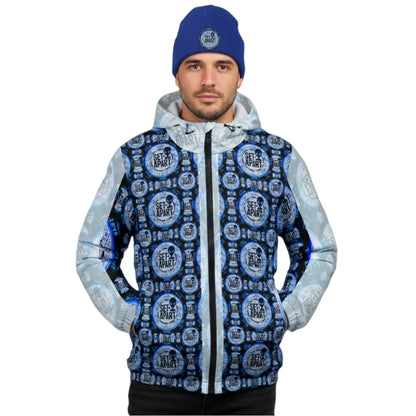 Man in a blue beanie and a zip-up hoodie featuring a repetitive blue and black "Set Apart" alien emblem pattern.