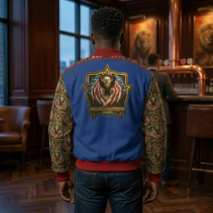 Rear view of a man wearing a blue bomber jacket with a large "American Hebrew" eagle emblem on the back and patterned sleeves, standing in a lounge.