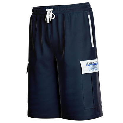 Side view of navy cargo shorts showing a vertical white stripe near the hip and a white pocket flap with "TENNESSEE HEBREW" text.